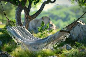 A cozy hammock strung between trees in a serene garden setting during daylight photo