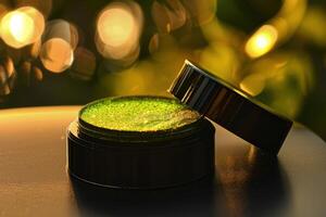 Close-up of open green cosmetic container resting on a surface with a soft bokeh background in natural light photo