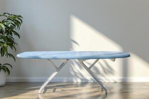 A modern ironing board in a bright room with potted plant and soft shadows photo