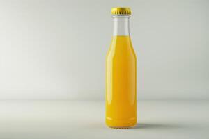 Glass bottle filled with bright yellow beverage on a plain background photo