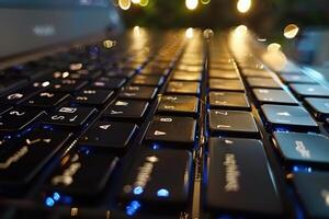 Close-up of a illuminated laptop keyboard with soft background lights in a cozy workspace at night photo