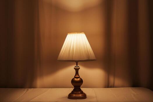 Softly lit table lamp on a minimalistic surface in a cozy indoor setting photo