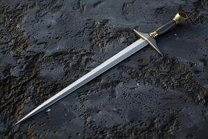 A detailed close-up of a polished sword on a rugged black stone surface photo