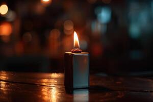 A close-up of a lit candle on a wooden table in a dimly lit room during the evening photo