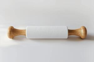 A wooden rolling pin on a light background, showcasing its smooth surface and sturdy build, perfect for baking activities in the kitchen photo
