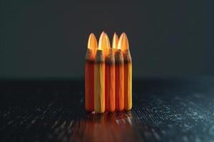 Vibrant crayons arranged in a colorful stack against a dark background photo