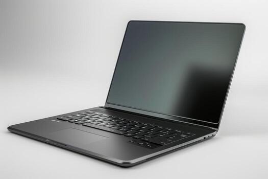 A sleek black laptop positioned on a neutral surface, showcasing its modern design and empty screen photo