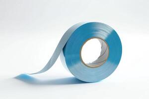 Blue masking tape roll displayed on a white background photo