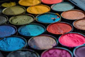 Colorful makeup palette with vibrant eye shadows in various shades arranged in a tray photo