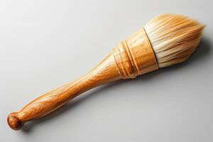 Wooden handle brush with soft bristles on a neutral background photo