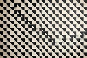Geometric black and white pattern on a textured surface creating a visual illusion photo