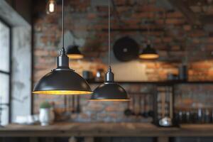 Warm pendant lights illuminate a rustic kitchen with exposed brick walls photo