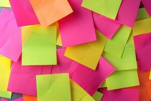 Colorful sticky notes scattered on a desk in a creative workspace photo
