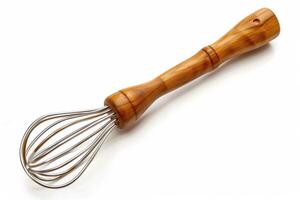 Wooden-handled whisk resting on a white background ready for mixing cooking ingredients photo