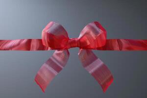 Decorative pink ribbon bow tied around a smooth surface photo