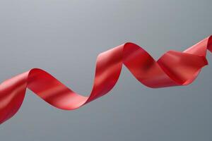 Red ribbon swaying gracefully against a neutral backdrop photo