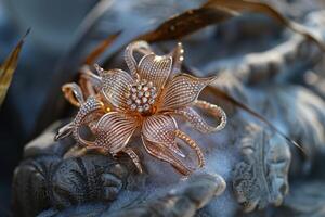 Exquisite gold floral bracelet with diamond accents resting on a textured surface photo