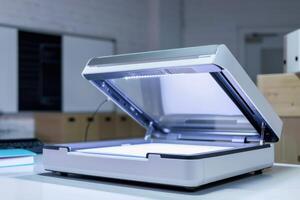 Scanner on a desk in a modern office with a bright workspace and organized materials photo