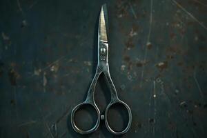 Vintage scissors placed against a rustic dark background, showcasing worn metal and classic design details photo