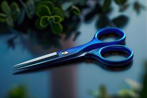 Blue scissors on a reflective surface with green plants in the background during the day photo