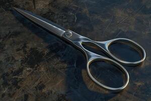 A pair of stainless steel scissors resting on a textured dark surface in a well-lit workspace photo