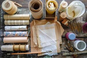 Crafting supplies arranged on a wooden table for a creative project photo