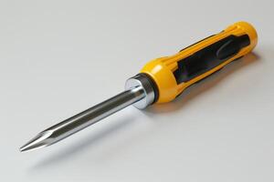 Yellow-handled screwdriver on a white surface, showcasing its steel tip and ergonomic grip photo