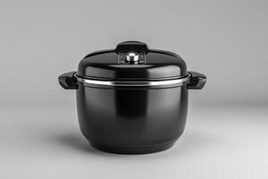 Modern black electric cooker on a plain background photo