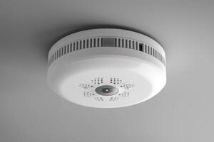 Smoke detector mounted on a ceiling in a modern room photo
