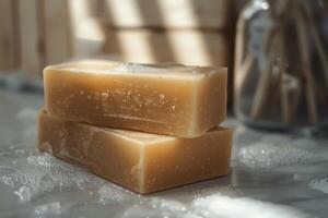 Natural handmade soap bars with bubbles resting on a marble countertop in soft sunlight photo