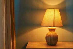 A cozy lamp illuminates a room corner in warm light during the evening photo