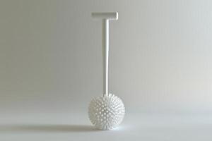 A minimalist white cleaning tool with a spiky ball head and T-handle against a light background photo