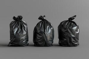 Three black garbage bags lined up on a gray surface photo