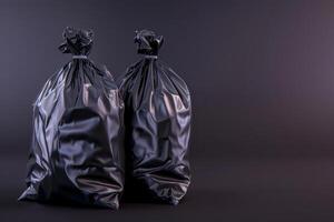 Two black trash bags on a dark background photo