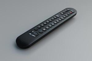 A sleek black remote control on a gray surface ready for use photo