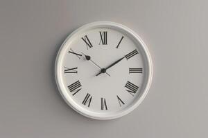 Wall clock with Roman numerals showing the time at three o'clock, mounted on a light grey wall photo