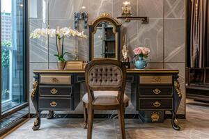 Elegant vintage vanity desk with flowers and a mirror in a modern interior design setting photo