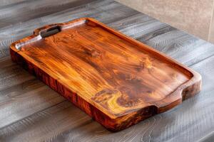 Artisanal wooden serving tray on a rustic table showcasing natural grain patterns and texture photo