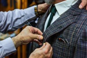 Tailoring a custom suit in a high-end tailor shop during the afternoon photo