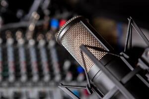 sound mixer and faders with condenser microphone DJ disco photo