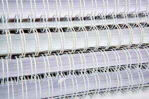 stack of large white notebooks as background concept photo