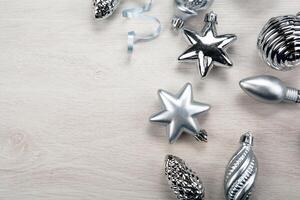 silver christmas glass toys on gray background photo