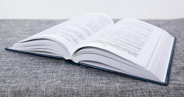 new open book on a gray table photo