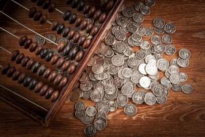 old abacus with russian ruble coins top view photo