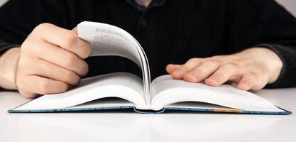 man is looking for information in the dictionary photo