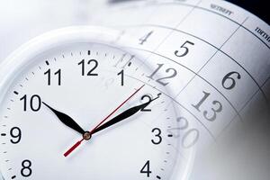 wall calendar with the number of days and clock photo