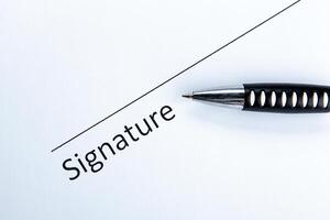 One document with a place for a signature and a pen photo