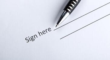 One document with a place for a signature and a pen photo