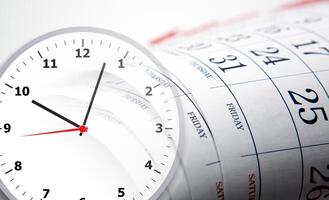 wall calendar with the number of days and clockface photo