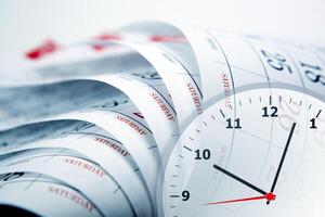 wall calendar with the number of days and clockface photo